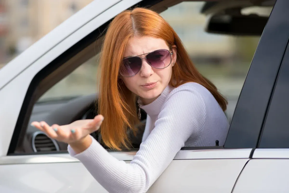 woman looking out car window