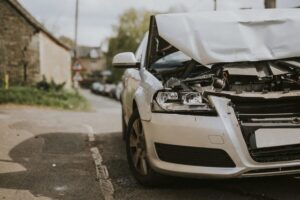 wreked car on the side of the road